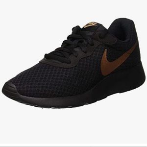 Nike tanjun black and rose gold sneakers